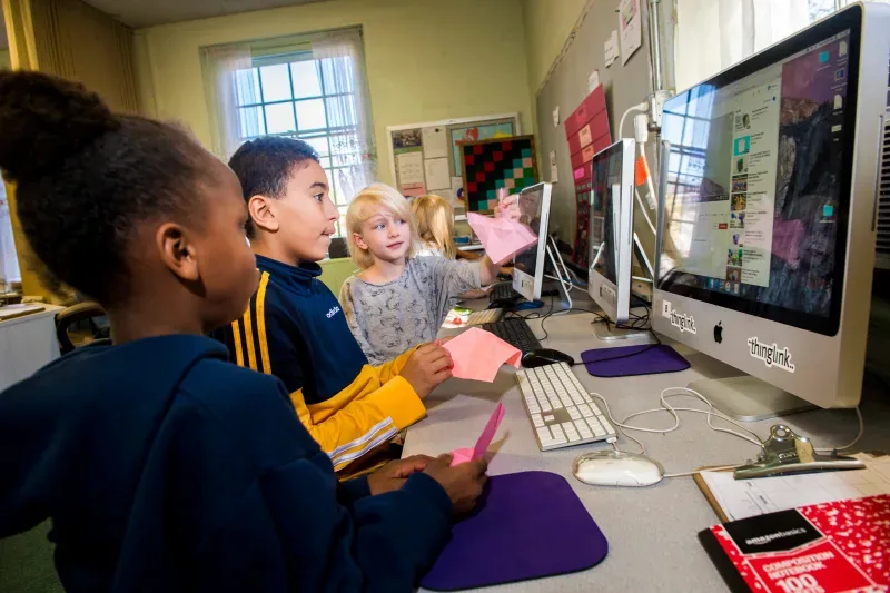 Students are working on Mac computers.