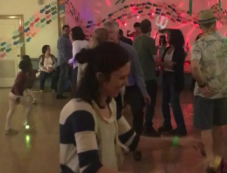 People are dancing and having fun at this OFS event.