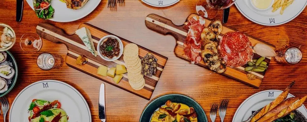 Photo from above a table with a full spread of delicious food.