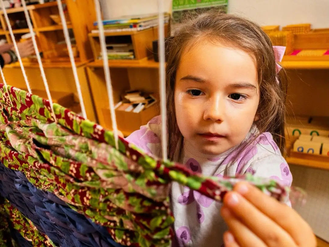 A student is working with textiles