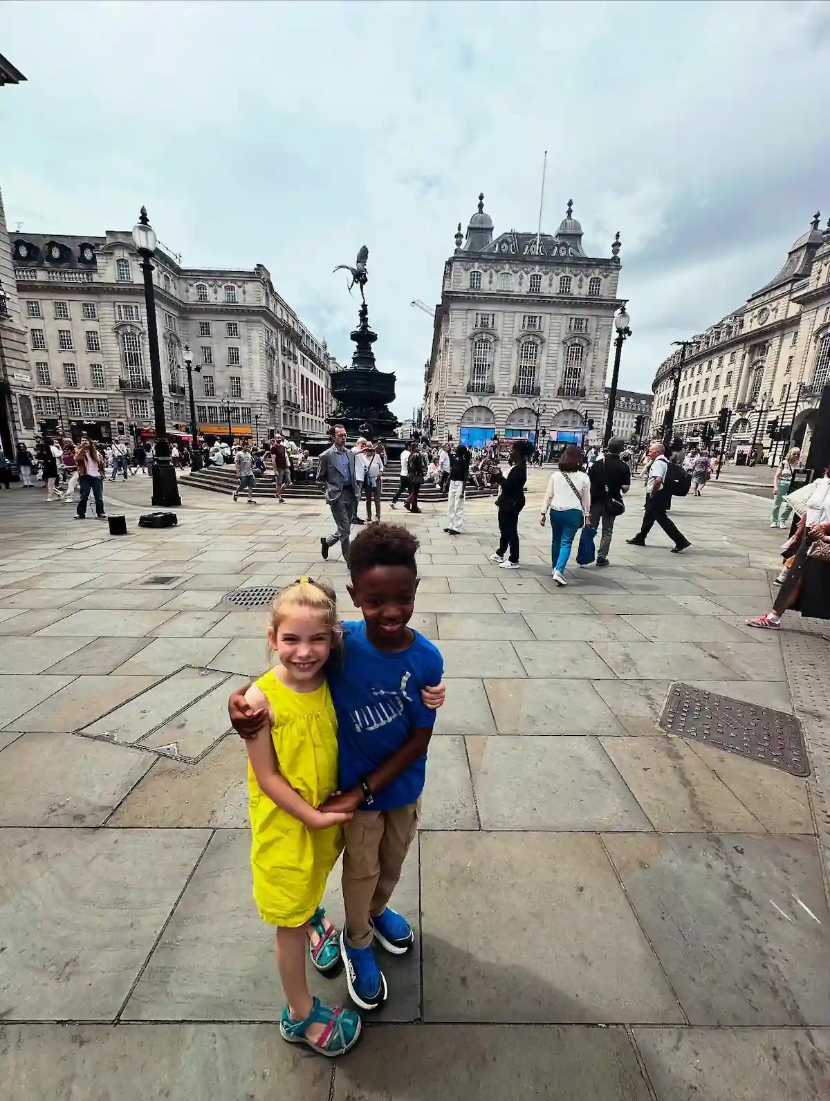 Photo of two young OFS students in Picadilly Square, London