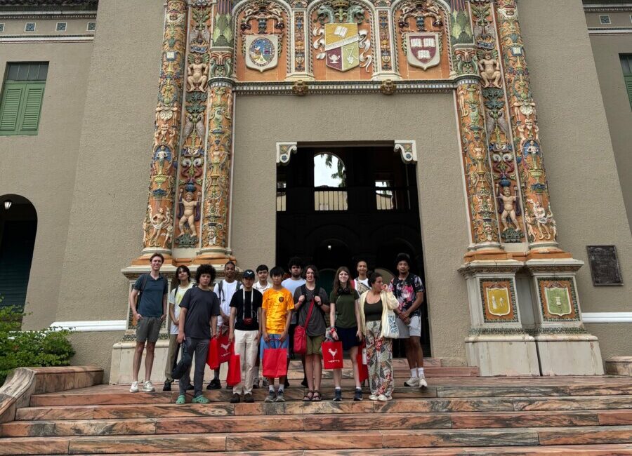 Students posed as a group in front of a church in Puerto Rico.